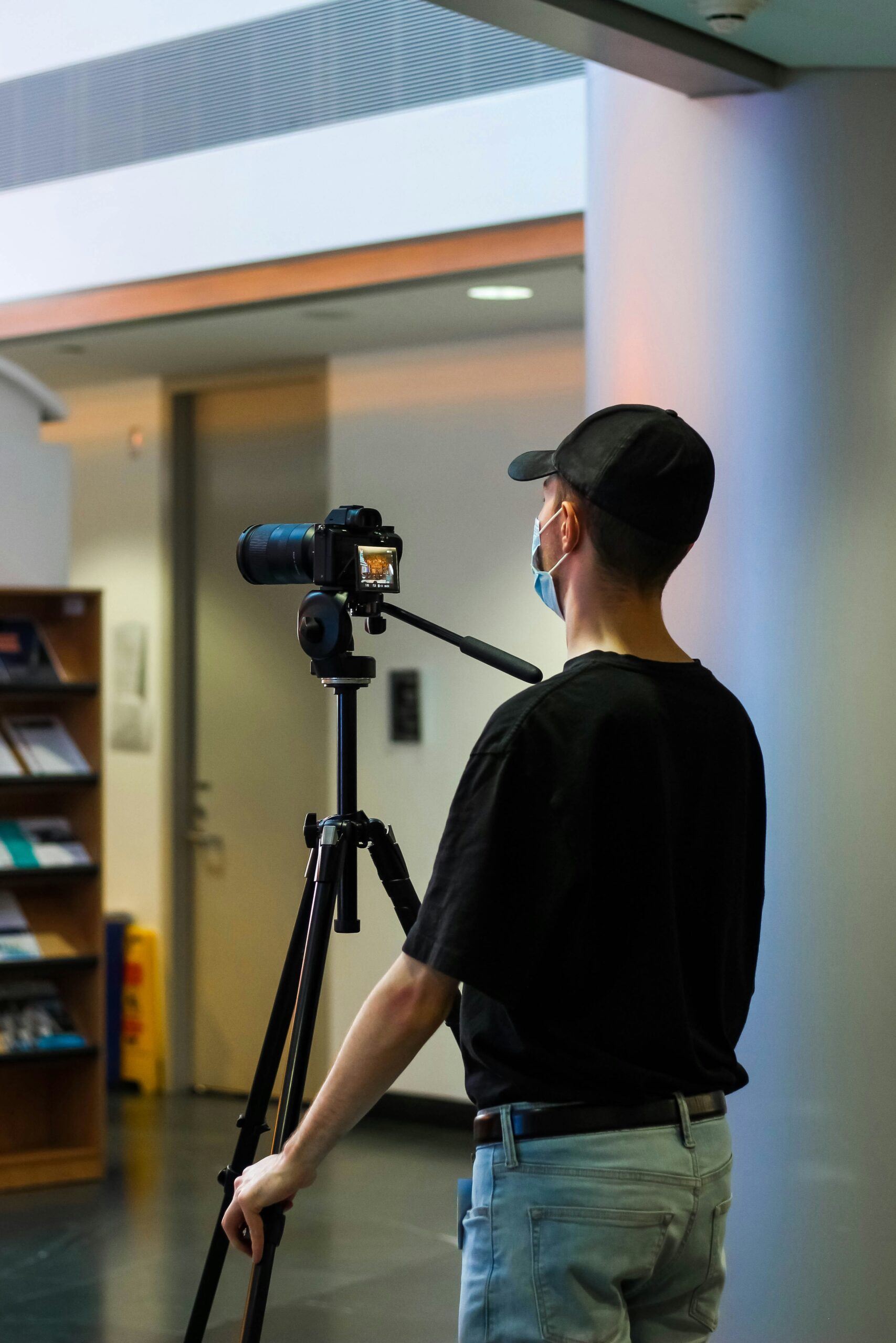 a man with a camera on his tripod